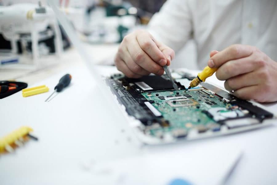 Picture of a Person Working on a hardware.