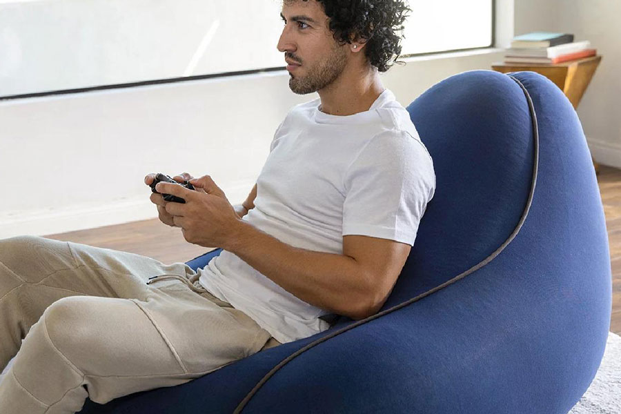 Picture of a gamer on a Gaming Bean Bag Chair, a wedding gift for video gamer.