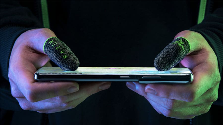 a picture of two hands playing with smart phone with finger sleeves.