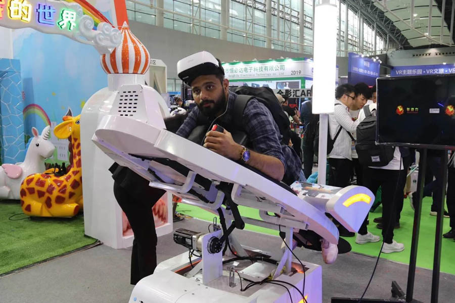 a male person playing with Virtual and Augmented Reality