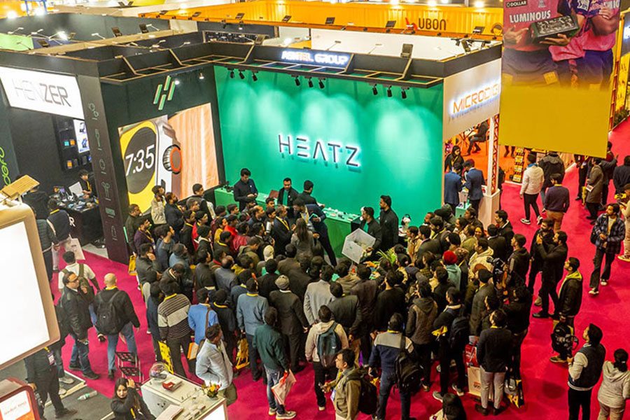 a hall filled with people in Digital Gaming India-Expo festival.