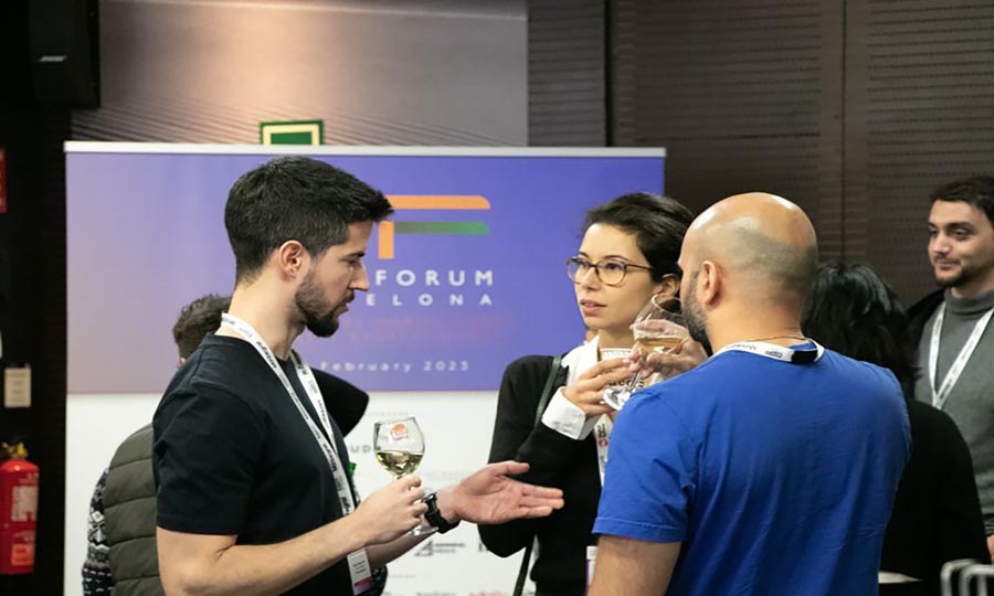 three persons talking about Gamesforum Barcelona 2025 in a room of festival.