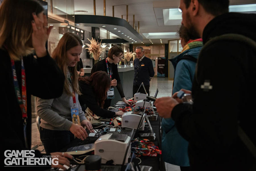 a room in Games Gathering Kyiv 2025 with women working with laptops